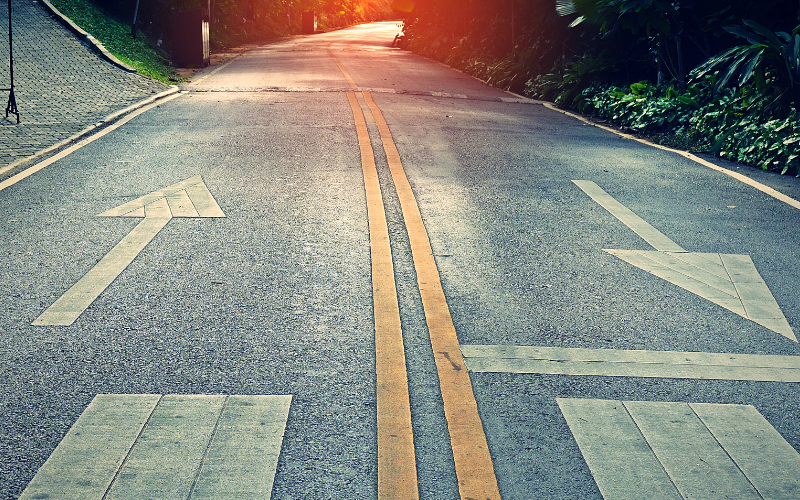 two way road divided by a double yellow line