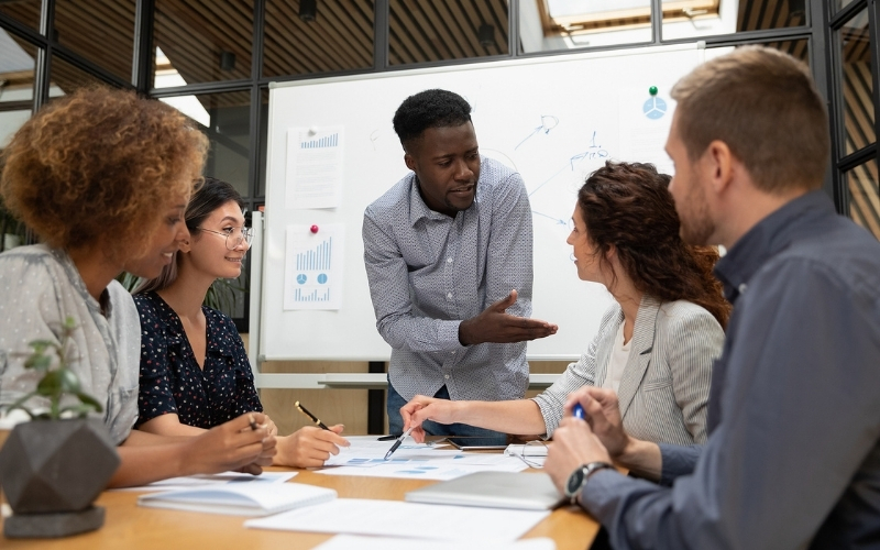 Diverse people discussing business