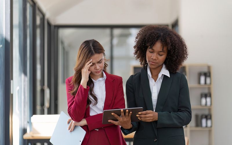 Two business women frustrated